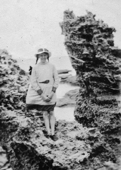 Peggy Beatty on rocks at Anglesea, Victoria, c. 1918