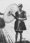Hilda McLean Forster in bathing costume with parasol on the waterfront at Anglesea, Victoria c. 1922