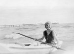 Peggy Beatty paddling a boat at Mentone, Victoria c. 1925